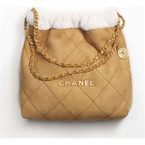 Chanel 22 mini handbag, Shearling lambskin & gold